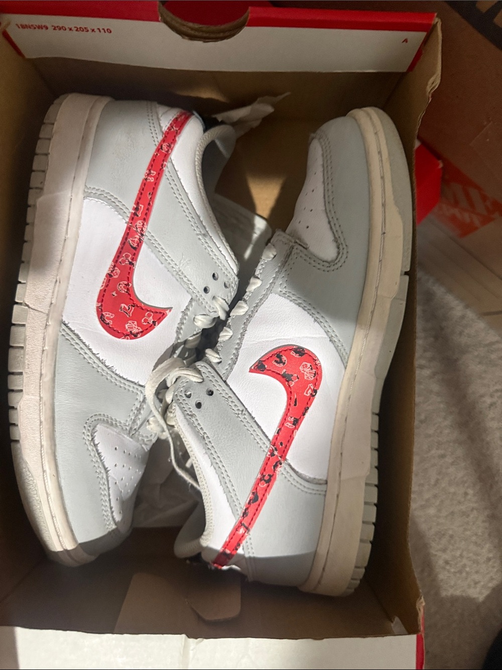 Nike White Kids Sneakers with Red Patterned Swoosh